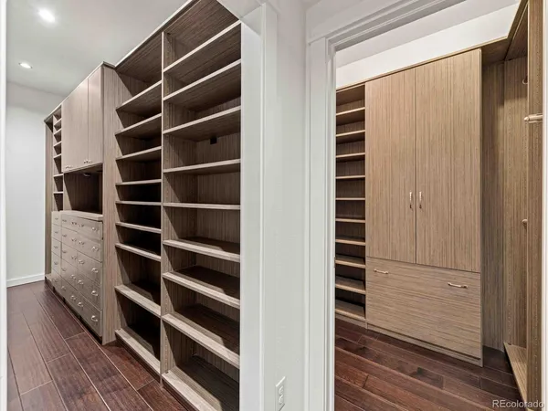a large kitchen with a sink and cabinets