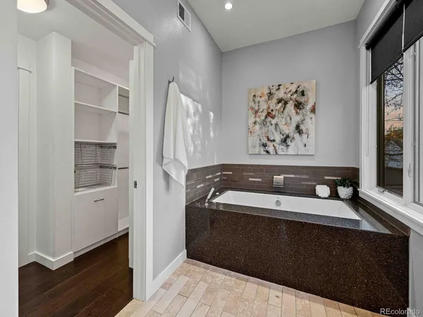 a utility room with mirror dryer and washer