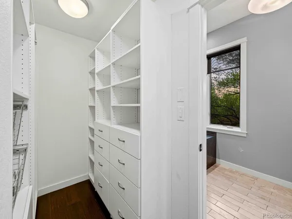 a view of a hallway view with wooden floor and staircase