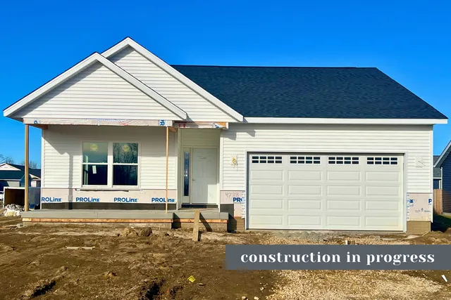 a view of a house with entrance and a potted plant
