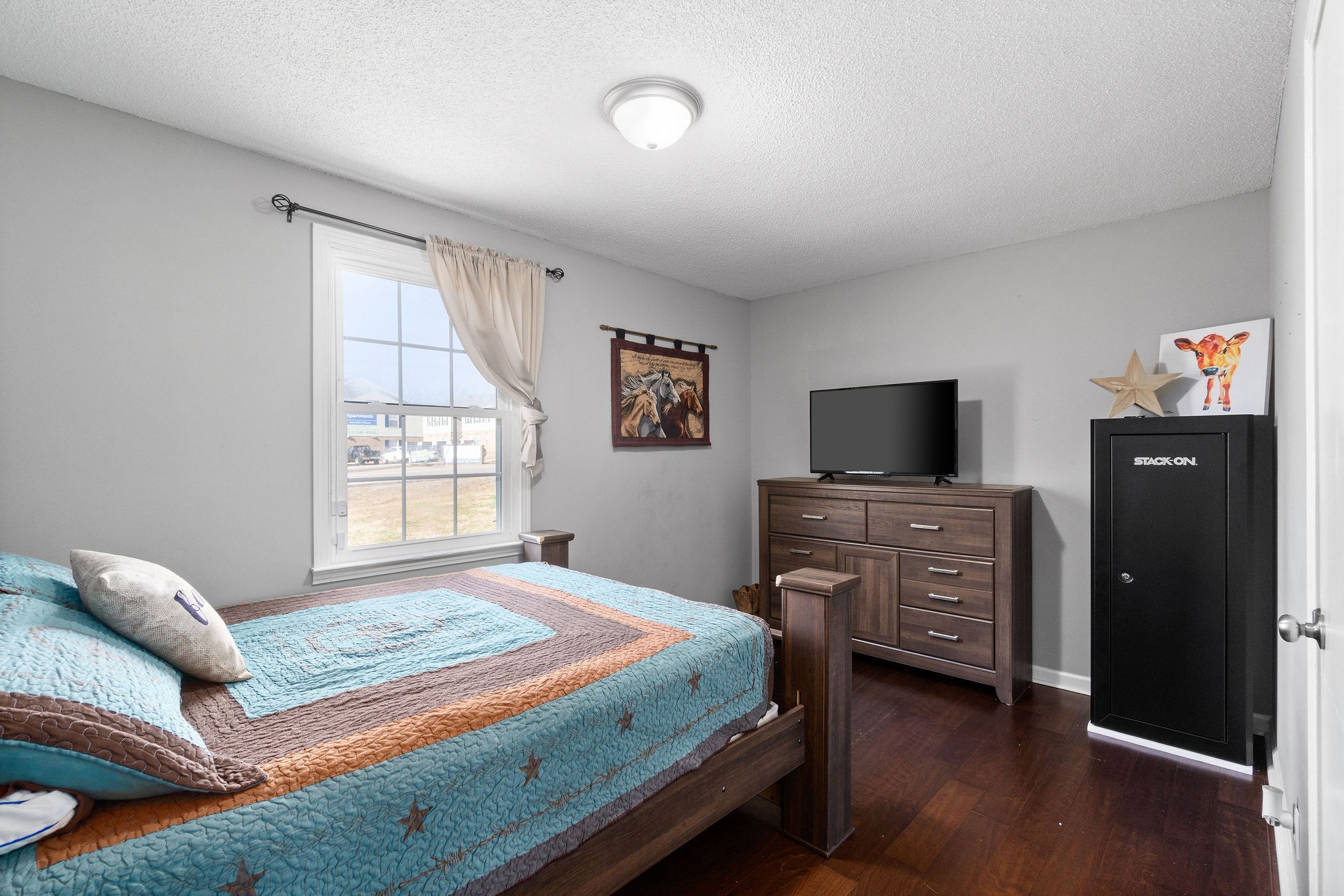 2445 Whitfield Road Clarksville, TN 37040 - Photo 16 of 29 a bedroom with a bed and a television