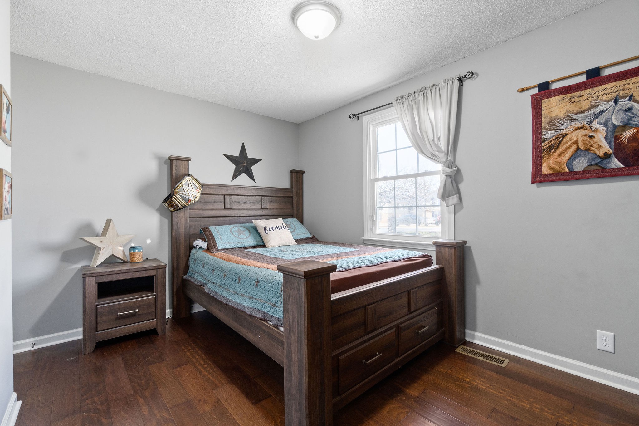 2445 Whitfield Road Clarksville, TN 37040 - Photo 17 of 29 a bed sitting in a bedroom next to a window