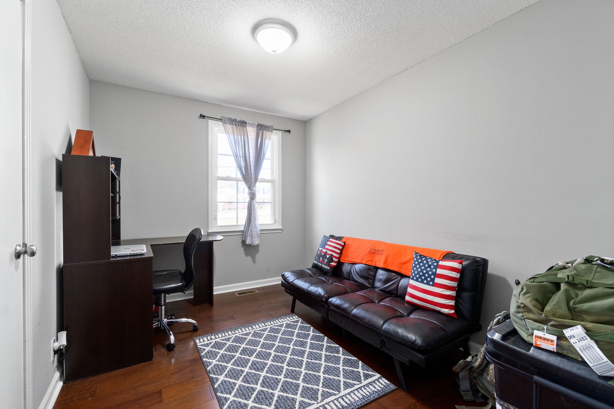 2445 Whitfield Road Clarksville, TN 37040 - Photo 19 of 29 a living room with furniture a rug and a window