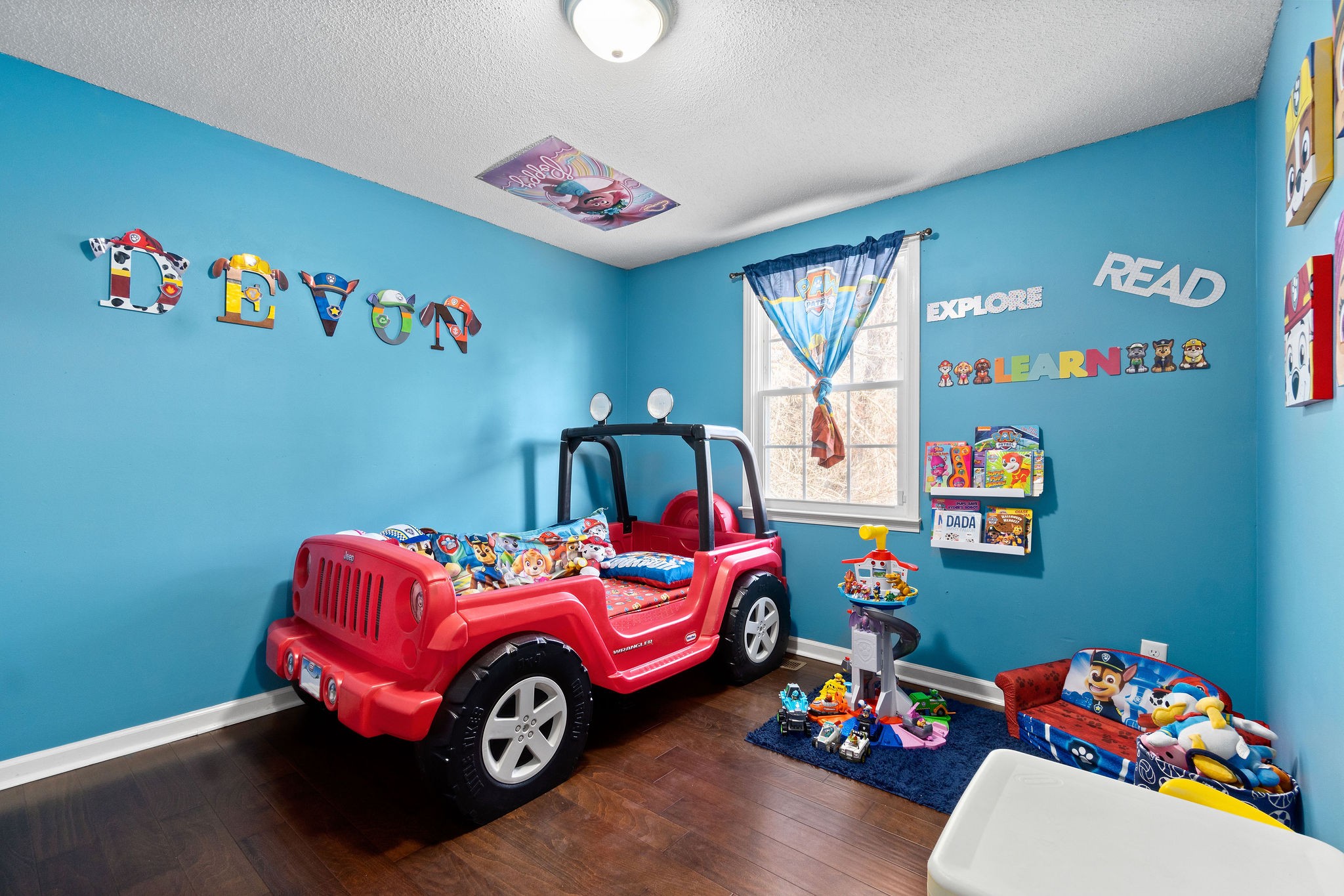 2445 Whitfield Road Clarksville, TN 37040 - Photo 22 of 29 a bedroom with toys and a wooden floor