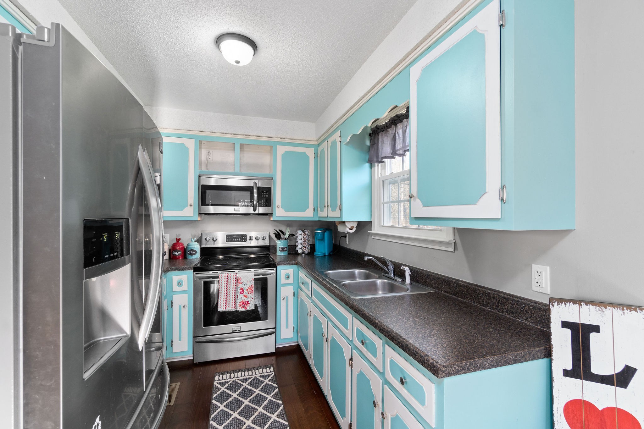2445 Whitfield Road Clarksville, TN 37040 - Photo 10 of 29 a kitchen that has a sink and a stove top oven