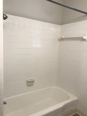 a close up of a bathtub curtain