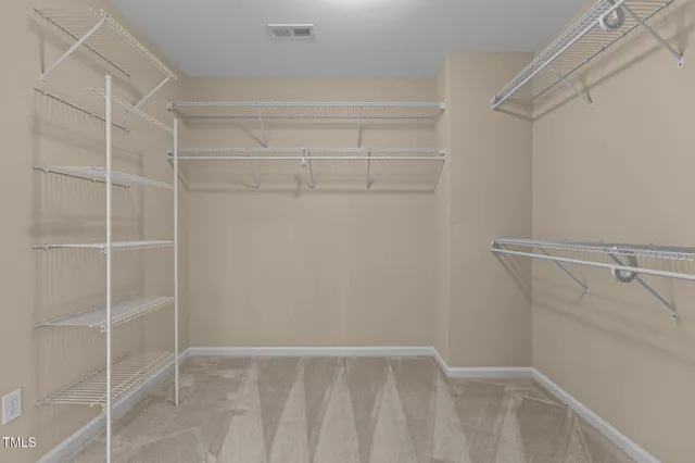 a view of an empty walk in closet