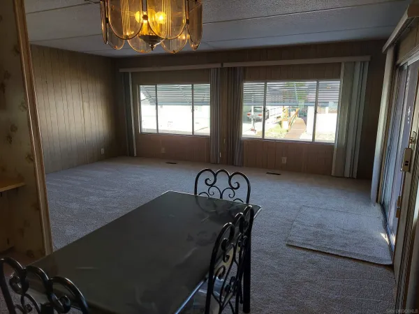 a view of a livingroom with furniture and window