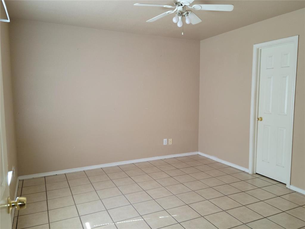 2782 Batey Road, Unit 2780 Collinsville, TX 76233 - Photo 3 of 9 Neutral-toned walls and square tileflooring define this interior space with bathroom