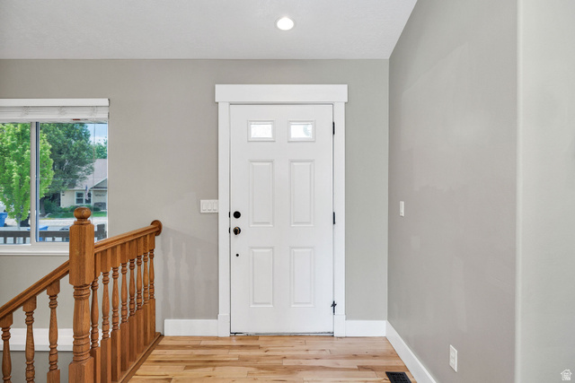 2912 South 1080th Street West Logan, UT 84321 - Photo 3 of 43 White paneled entry door with frosted glass inserts, framed by white trim