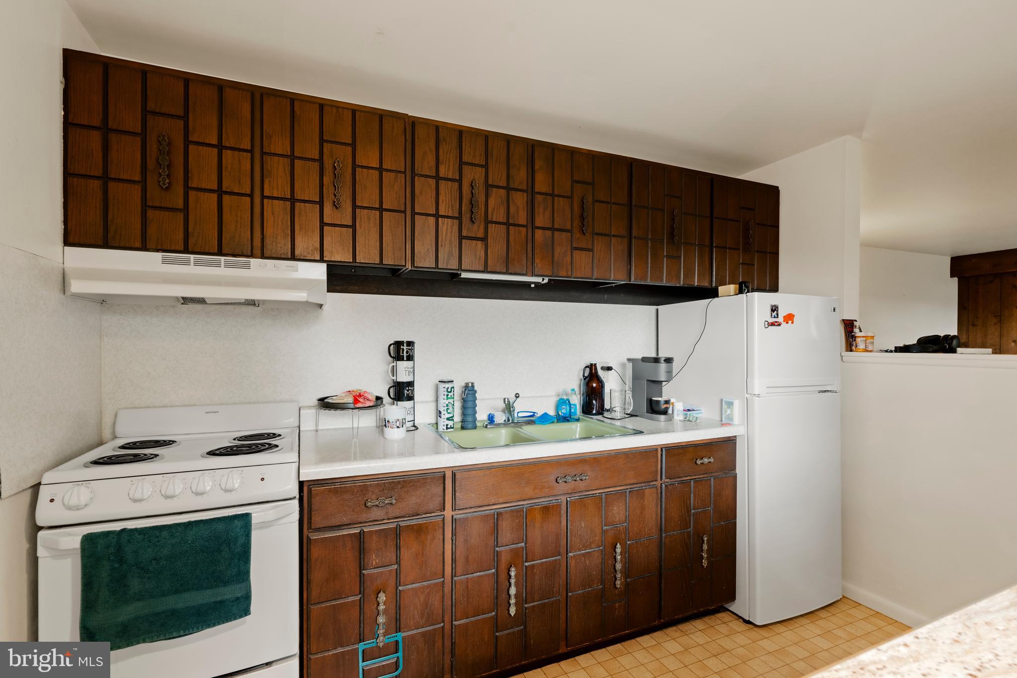 619 Millersville Road Lancaster, PA 17603 - Photo 14 of 30 a kitchen with stainless steel appliances a stove a sink a refrigerator and cabinets