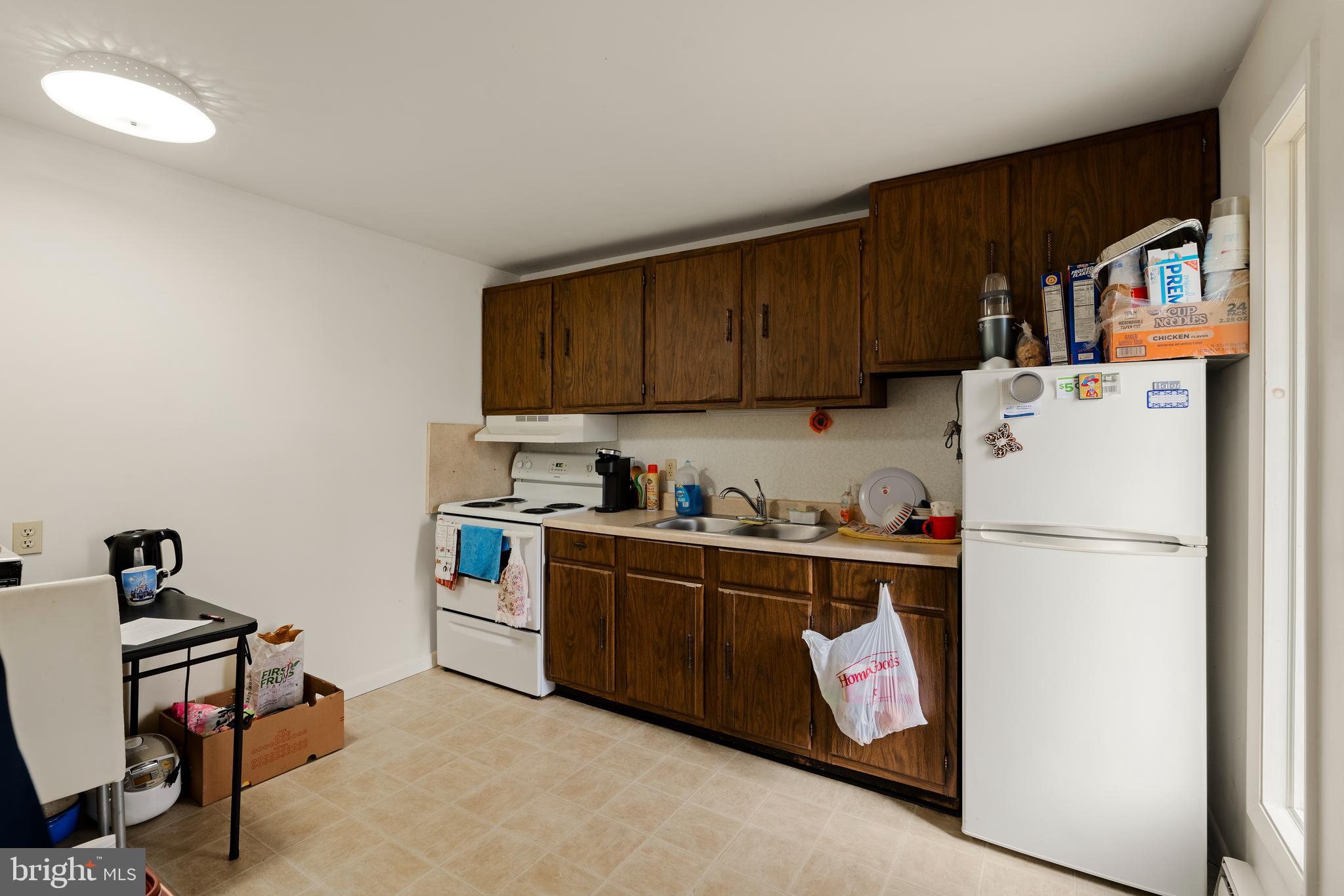 619 Millersville Road Lancaster, PA 17603 - Photo 5 of 30 a kitchen with refrigerator and cabinets