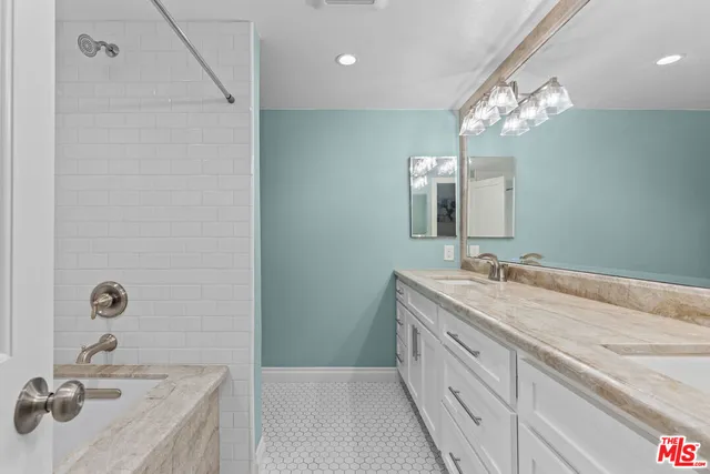 a bathroom with a sink a vanity and a mirror