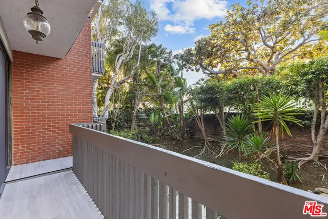 a view of a balcony with plants