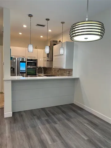 a bathroom with a sink a mirror and a shower