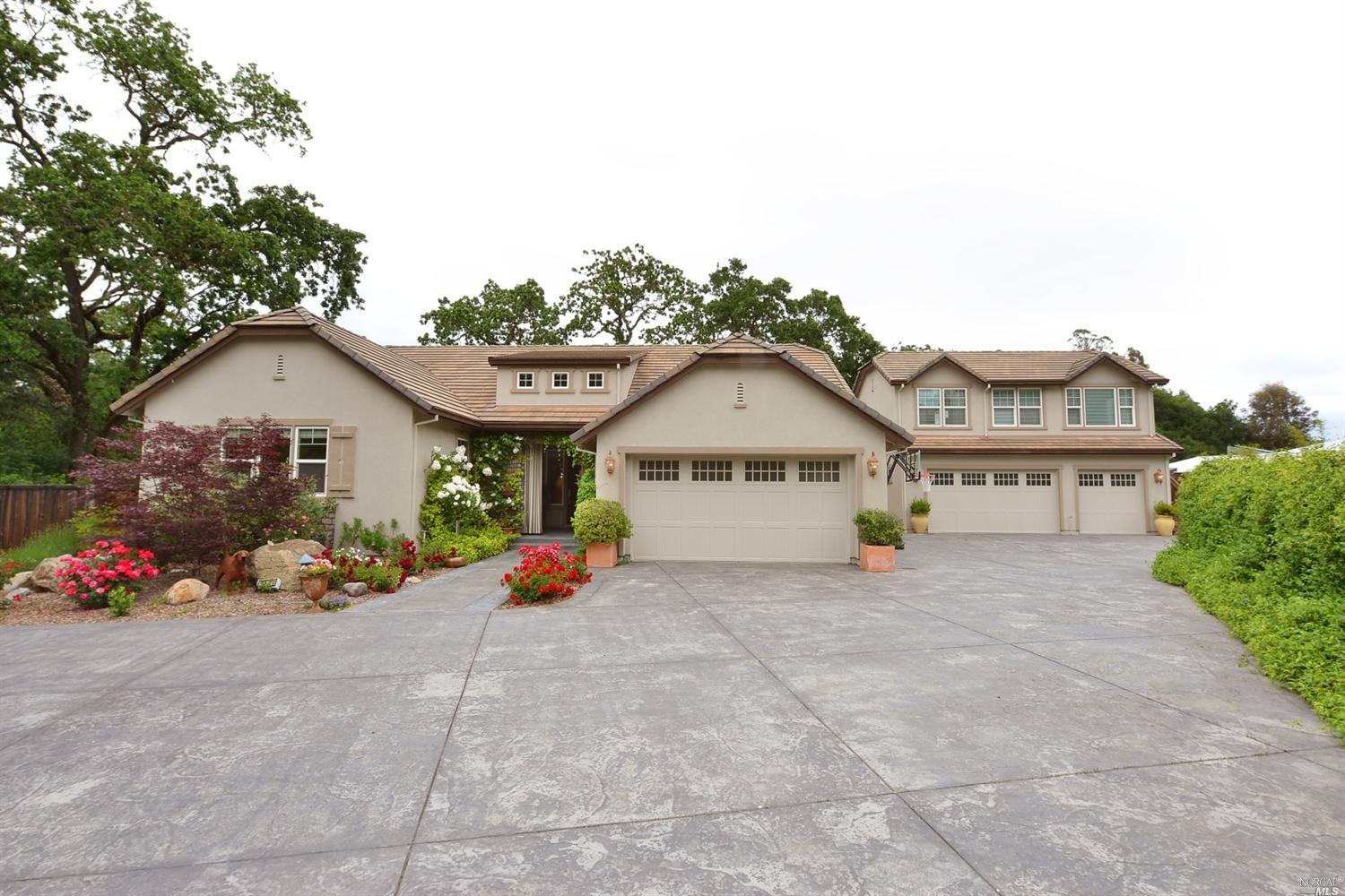 5771 Melita Road Santa Rosa, CA 95409 - Photo 1 of 1 a view of a house with a small yard and a large tree