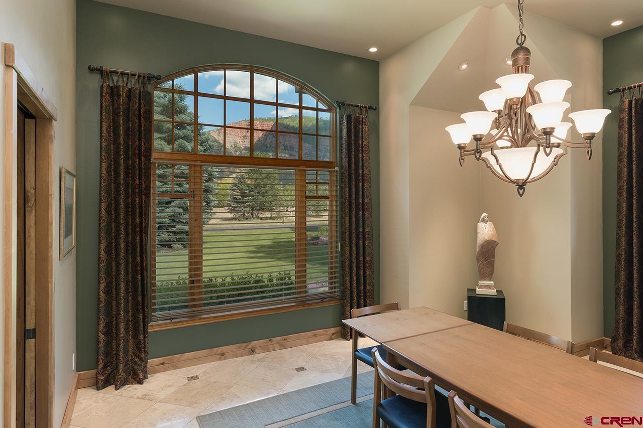 435 Red Rock Road Durango, CO 81301 - Photo 15 of 35 a dining room with furniture and window