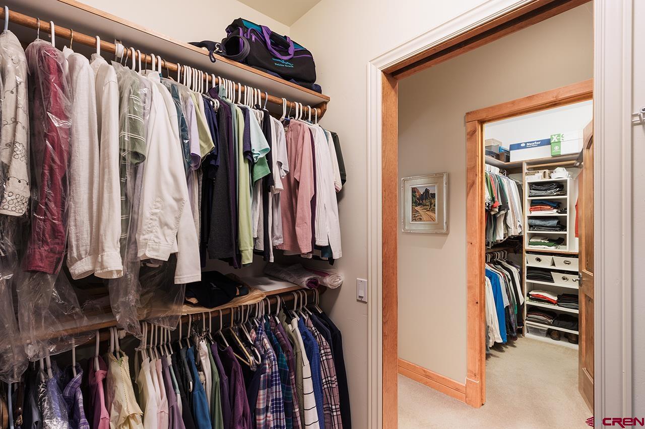 435 Red Rock Road Durango, CO 81301 - Photo 20 of 35 a view of walk in closet with clothes and shoes