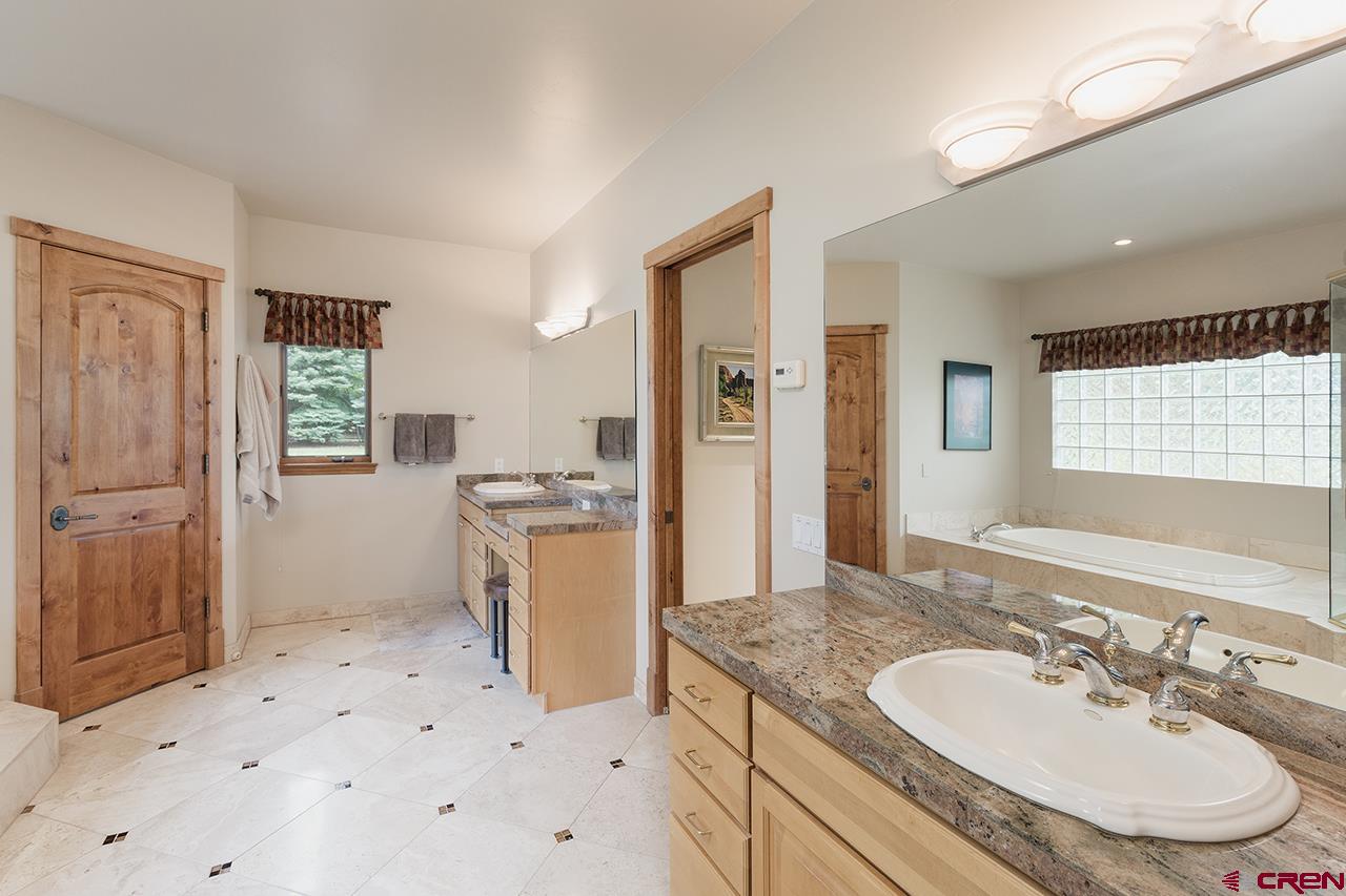 435 Red Rock Road Durango, CO 81301 - Photo 21 of 35 a bathroom with a sink and a mirror