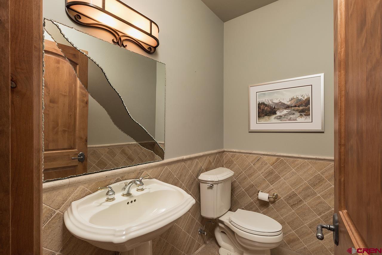 435 Red Rock Road Durango, CO 81301 - Photo 23 of 35 a bathroom with a toilet a sink and mirror