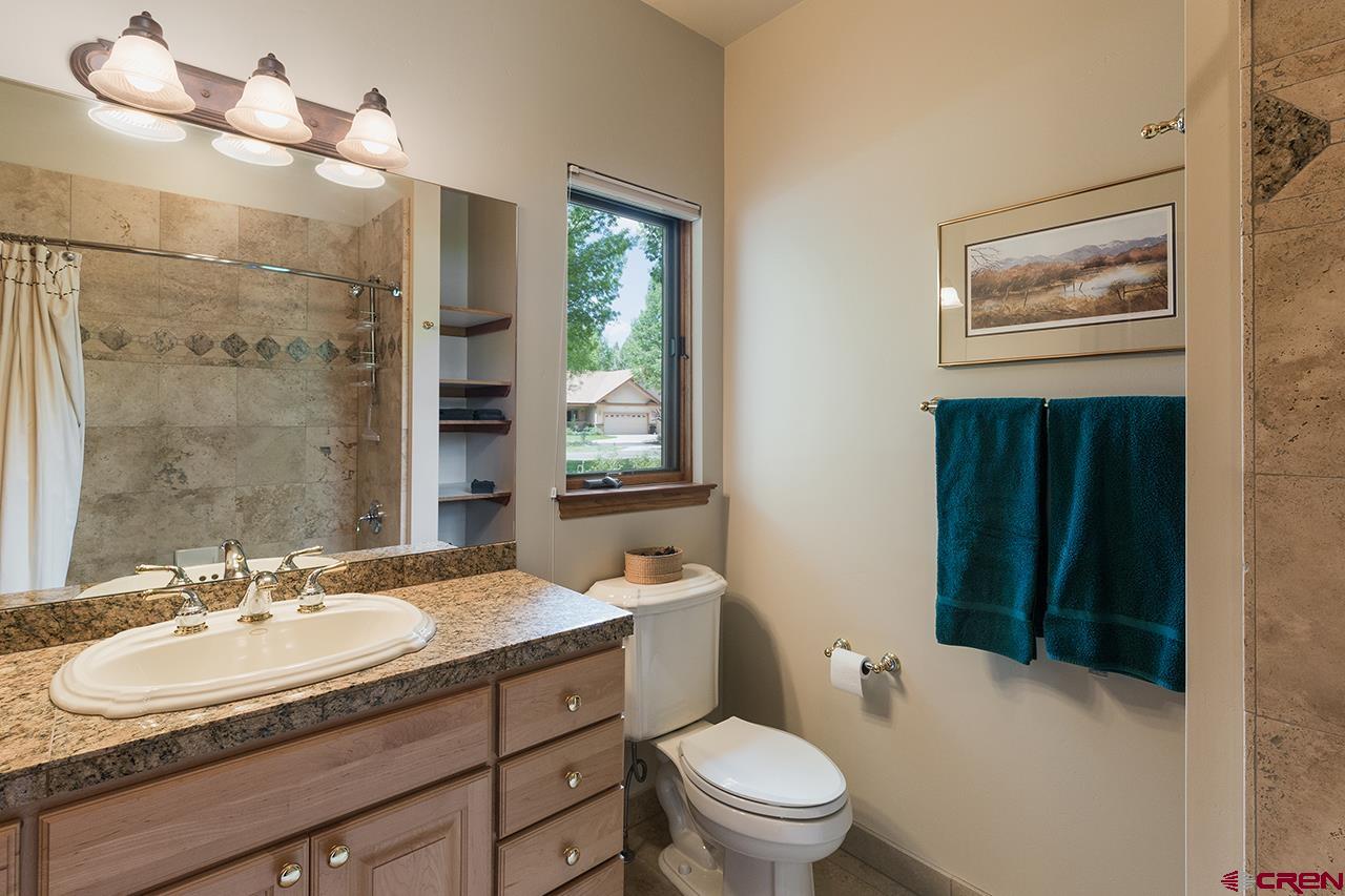 435 Red Rock Road Durango, CO 81301 - Photo 25 of 35 a bathroom with a sink toilet and shower