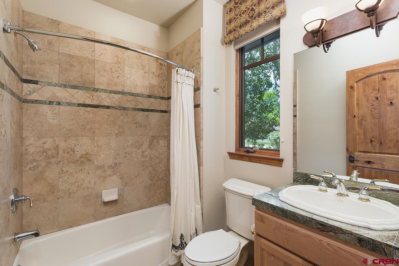 435 Red Rock Road Durango, CO 81301 - Photo 27 of 35 a bathroom with a sink toilet and shower