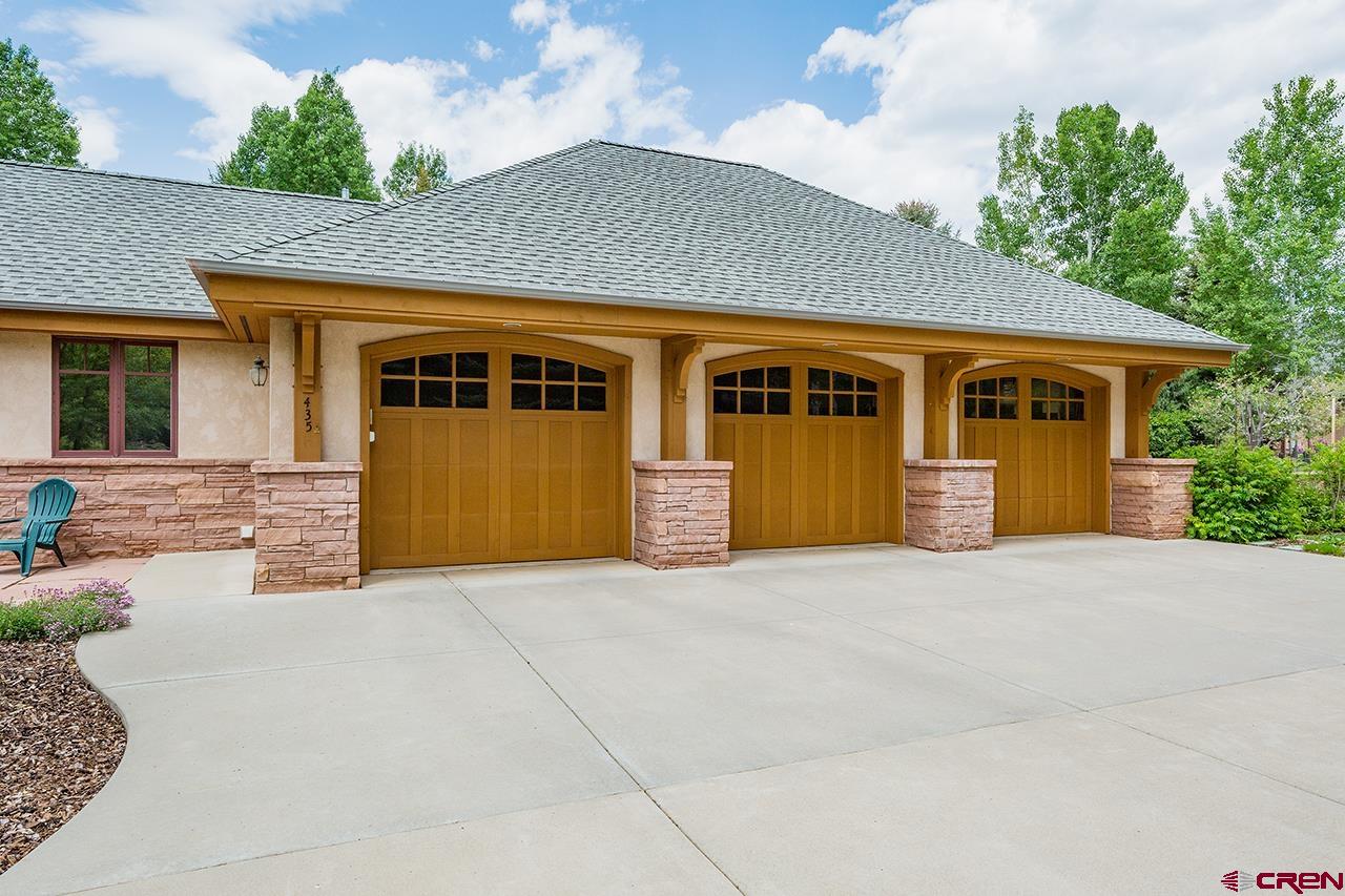 435 Red Rock Road Durango, CO 81301 - Photo 33 of 35 a front view of a house with yard and trees
