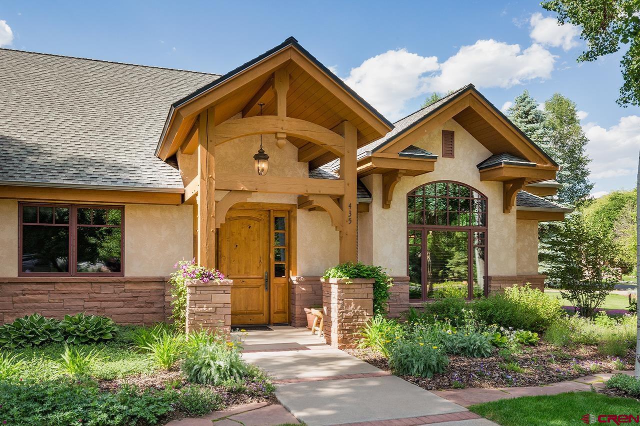 435 Red Rock Road Durango, CO 81301 - Photo 5 of 35 a front view of a house with a yard