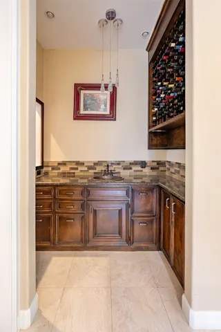 a kitchen with stainless steel appliances granite countertop a stove and a refrigerator