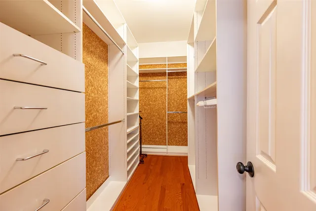 a living room with furniture ceiling fan and a window
