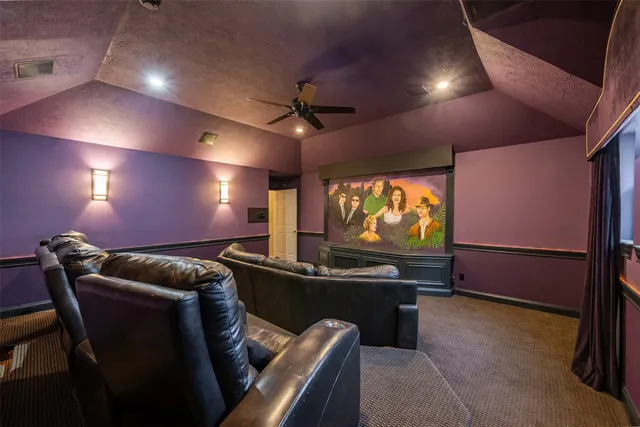 a view of a livingroom with a ceiling fan and window