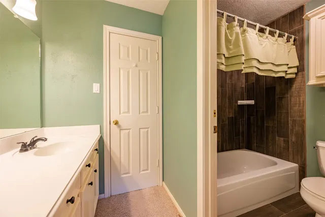 a view of a livingroom with a ceiling fan and window