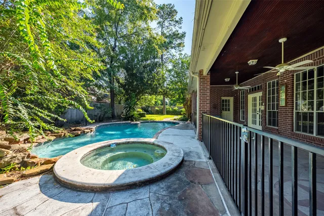 a view of a swimming pool with a patio