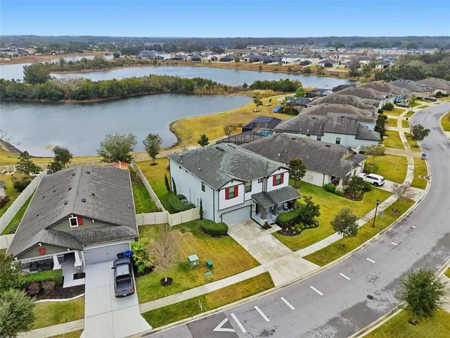an aerial view of a house with a ocean view