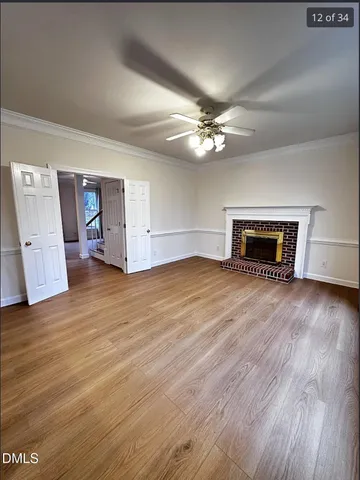 a view of livingroom with hardwood floor and a ceiling fan