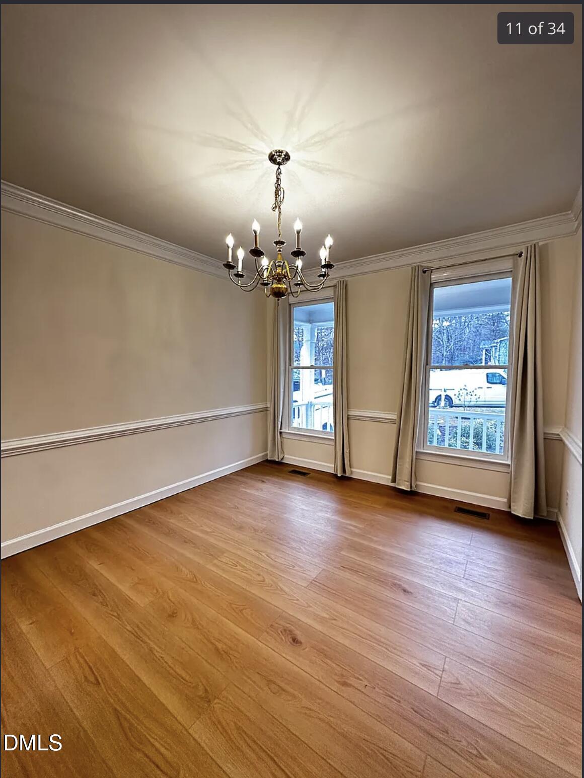 214 Cobble Ridge Drive Chapel Hill, NC 27516 - Photo 16 of 34 wooden floor in an empty room with a window
