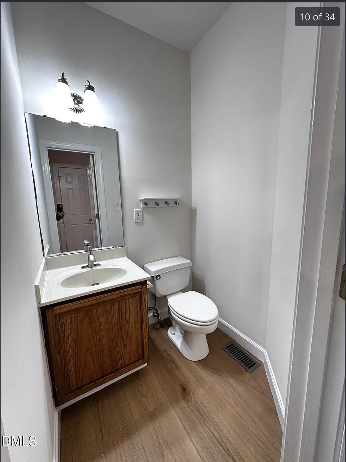 214 Cobble Ridge Drive Chapel Hill, NC 27516 - Photo 24 of 34 a bathroom with a sink and a mirror