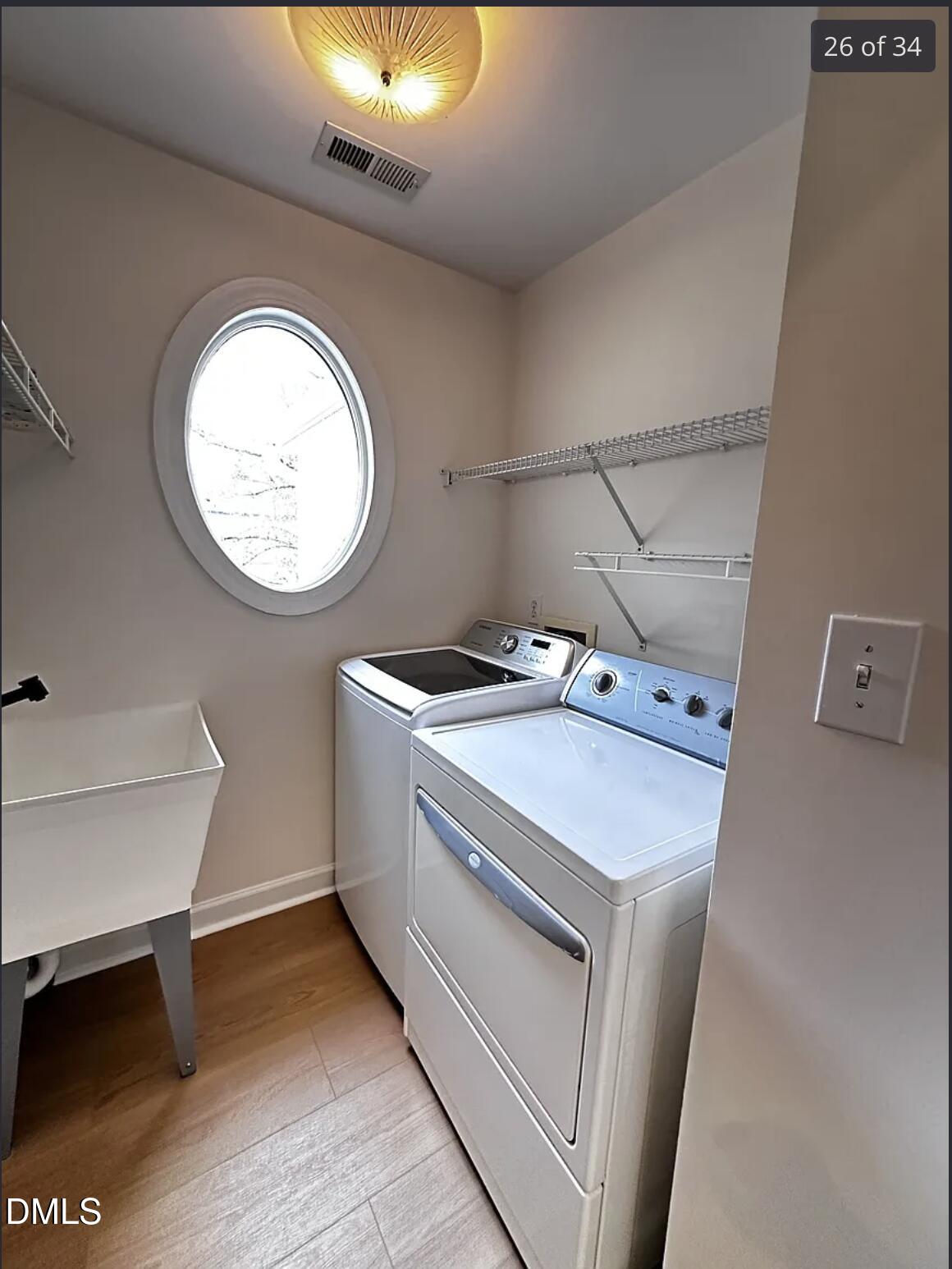 214 Cobble Ridge Drive Chapel Hill, NC 27516 - Photo 27 of 34 a utility room with dryer and washer