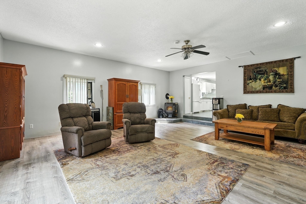 12 Pond Brook Road Huntington, MA 01050 - Photo 21 of 38 a living room with furniture a ceiling fan and a rug
