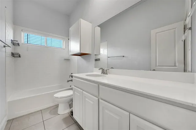 a bathroom with a toilet a sink and bathtub