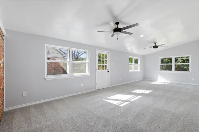 a view of empty room with windows