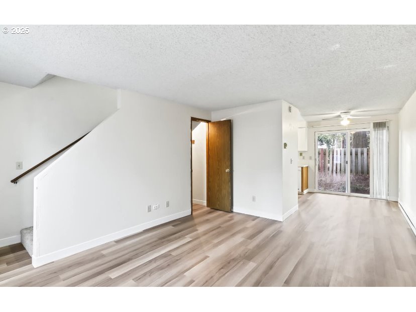 15 Northeast 127th Avenue Portland, OR 97230 - Photo 8 of 8 a view of an empty room with wooden floor