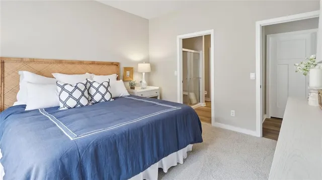 a bedroom with a bed and a mirror