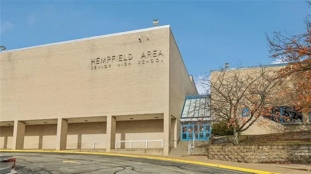 a front view of a building with retail shops