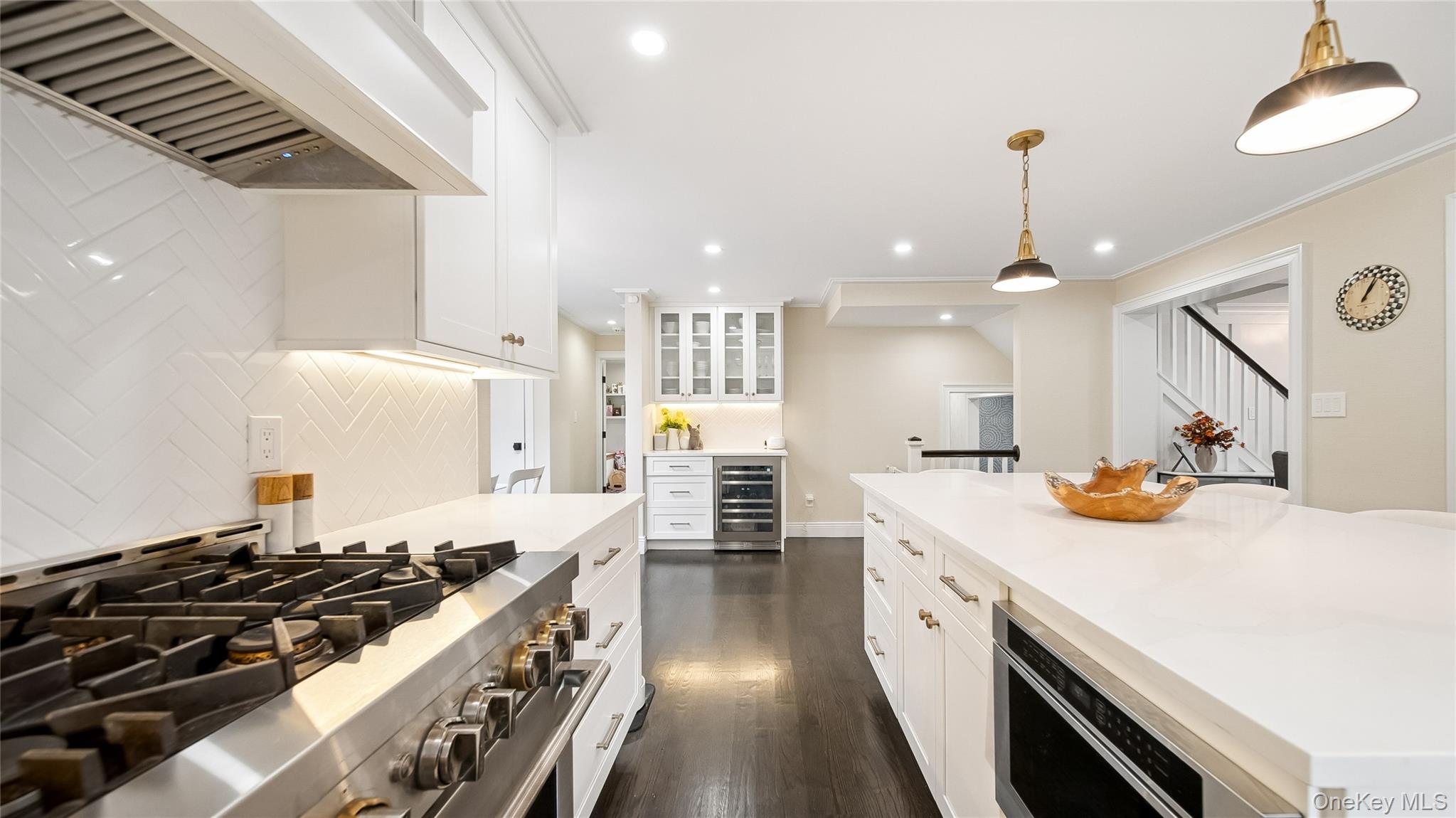 305 Nassau Avenue Manhasset, NY 11030 - Photo 11 of 27 a kitchen with stove and wooden floor
