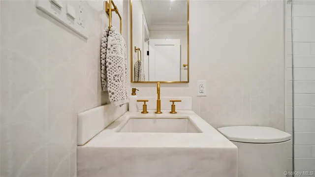 a spacious bedroom with a bed and a window