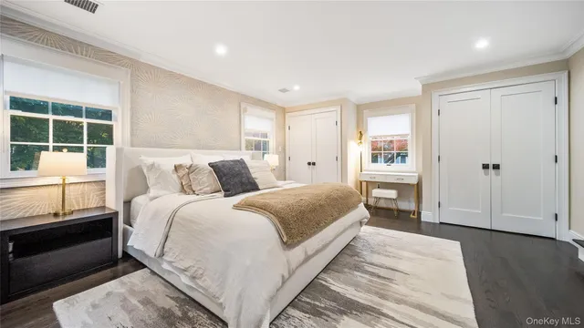 a bedroom with a bed and a table