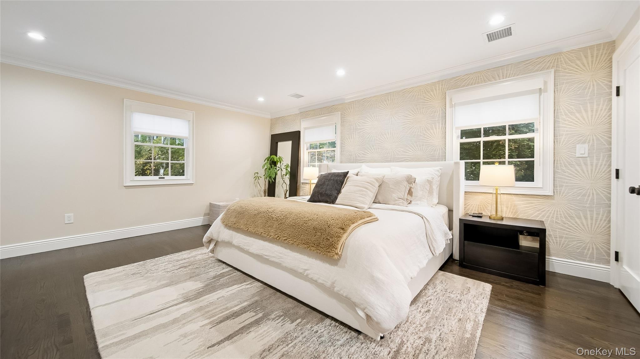 305 Nassau Avenue Manhasset, NY 11030 - Photo 19 of 27 a bedroom with a large bed and a window