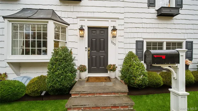 a front view of a house with garden