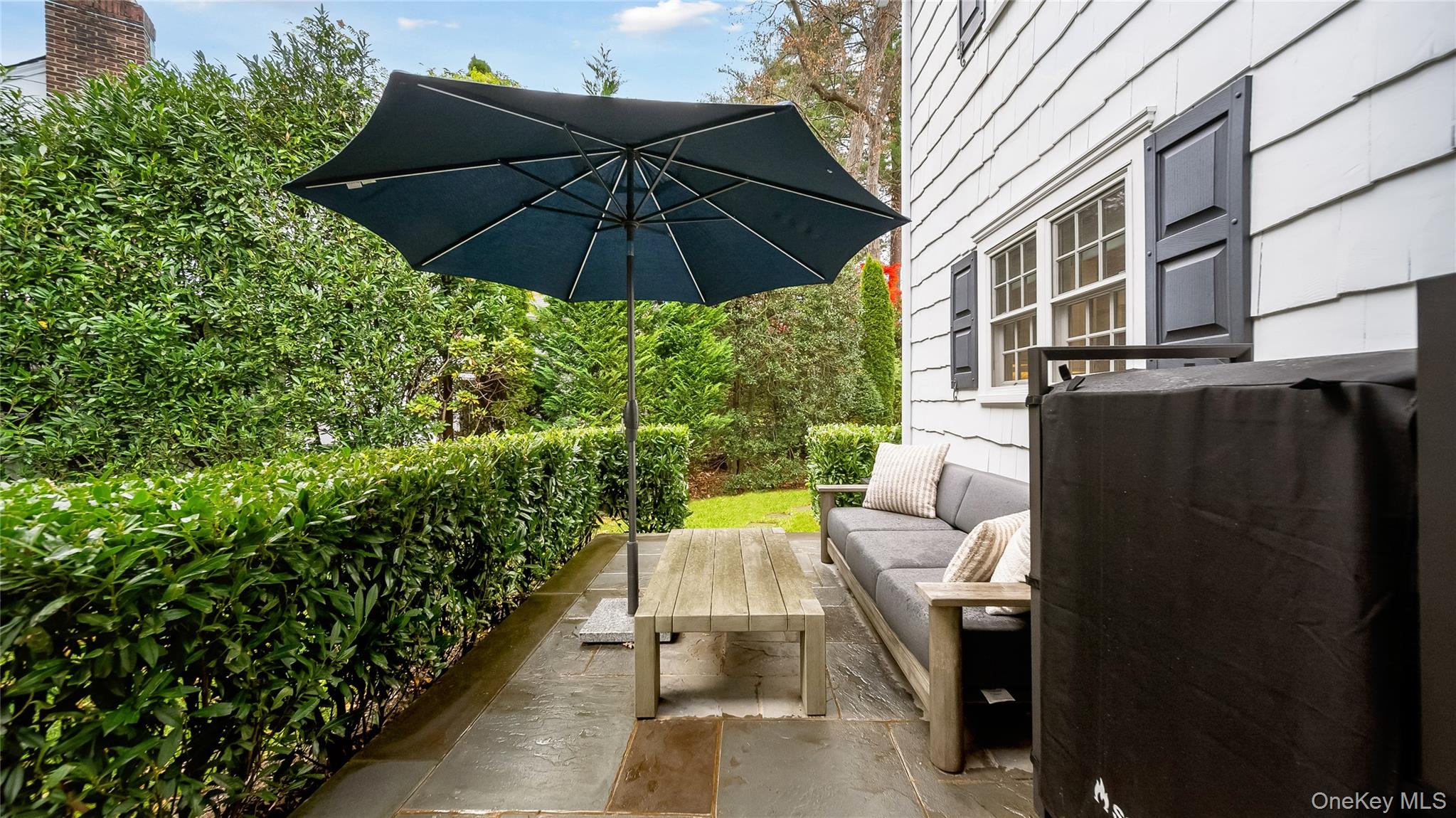 305 Nassau Avenue Manhasset, NY 11030 - Photo 25 of 27 an outdoor view of patio with umbrella